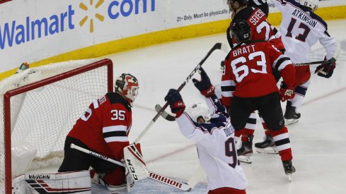 Columbus Blue Jackets right wing Cam Atkinson (13) celebrates after scoring a goal against New Jersey Devils goaltender Cory Schneider (35) during the first period at Prudential Center.