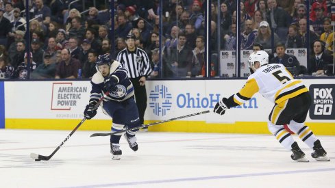  Columbus Blue Jackets left wing Artemi Panarin (9) passes the puck against the Pittsburgh Penguins during the second period at Nationwide Arena.