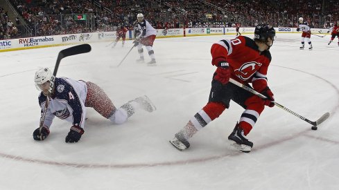 Blake Coleman spins away from Scott Harrington at Prudential Center