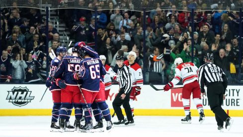 The Columbus Blue Jackets celebrate a first period goal from defenseman David Savard against the Carolina Hurricanes at Nationwide Arena.