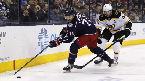 Columbus Blue Jackets left wing Nick Foligno (71) and Columbus Blue Jackets center Alexandre Sexier (42) chase down a loose puck during the second period at Nationwide Arena.