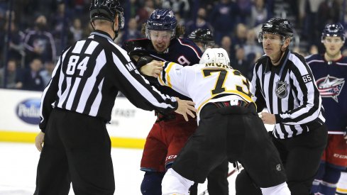 Artemi Panarin drops the mitts with Charlie McAvoy