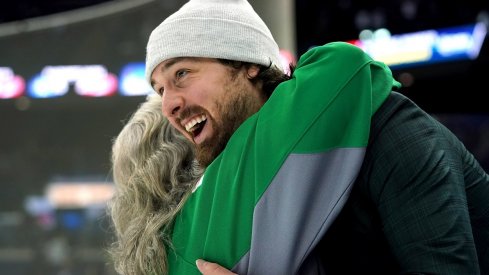 Keith Kinkaid hugs a fan post-game after the Columbus Blue Jackets St. Patrick's Day game