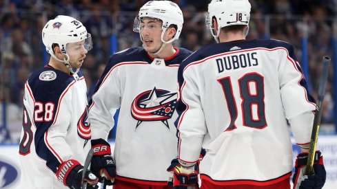 Columbus Blue Jackets center Pierre-Luc Dubois celebrates a goal with Oliver Bjorkstrand and Zach Werenski.