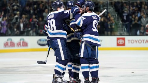 Oct 18, 2018; Columbus, OH, USA; Columbus Blue Jackets left wing Nick Foligno (back right) celebrates with teammates defenseman David Savard (58) and left wing Anthony Duclair (91) after scoring a goal against the Philadelphia Flyers in the second period at Nationwide Arena.