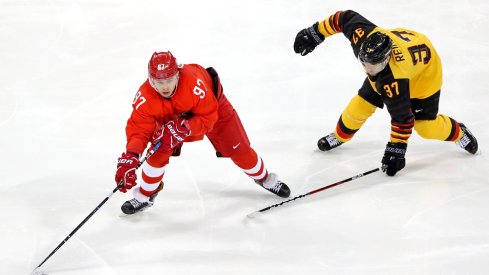 Nikita Gusev stickhandles for OAR in the Gold Medal hockey game against Germany