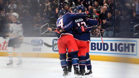 Columbus Blue Jackets right wing Cam Atkinson (13) celebrates with teammates after scoring a goal on a power play against the Buffalo Sabres in the first period at Nationwide Arena