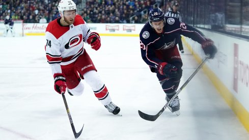 Mar 15, 2019; Columbus, OH, USA; Carolina Hurricanes defenseman Jaccob Slavin (74) skates against Columbus Blue Jackets center Riley Nash (20) in the second period at Nationwide Arena.