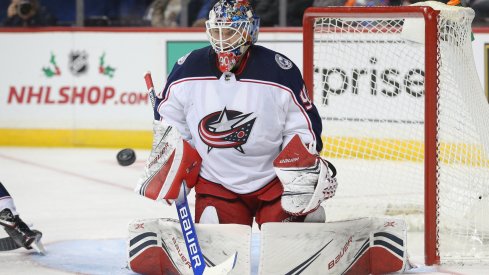 Nov 30, 2019; Brooklyn, NY, USA; Columbus Blue Jackets goalie Elvis Merzlikins (90) defends a shot against the New York Islanders during the second period at Barclays Center. Mandatory Credit: Brad Penner-USA TODAY Sports