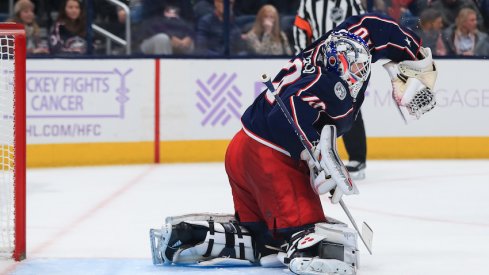 Columbus Blue Jackets goaltender Joonas Korpisalo (70) makes a glove save in net against the St. Louis Blues in the third period at Nationwide Arena.