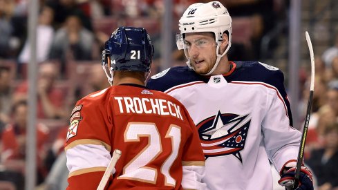 Oct 11, 2018; Sunrise, FL, USA; Columbus Blue Jackets center Pierre-Luc Dubois (18) exchange words with Florida Panthers center Vincent Trocheck (21) during the first period at BB&T Center. 