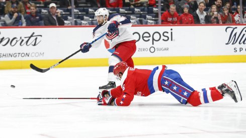 Dec 9, 2019; Washington, DC, USA; Columbus Blue Jackets right wing Oliver Bjorkstrand (28) shoots the puck as Washington Capitals defenseman Michal Kempny (6) defends in the first period at Capital One Arena. Mandatory Credit: Geoff Burke-USA TODAY Sports