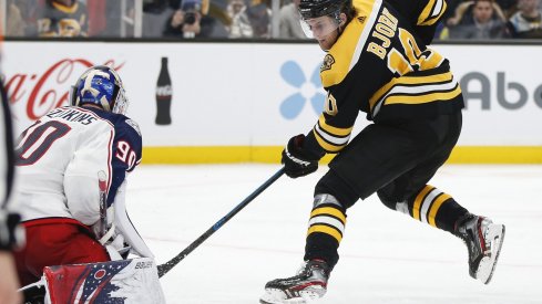 Jan 2, 2020; Boston, Massachusetts, USA; Columbus Blue Jackets goaltender Elvis Merzlikins (90) stops a shot by Boston Bruins left wing Anders Bjork (10) during the third period at TD Garden.