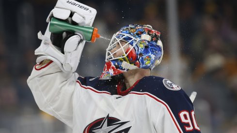 Jan 2, 2020; Boston, Massachusetts, USA; Columbus Blue Jackets goaltender Elvis Merzlikins (90) sprays water on his face during the third period against the Boston Bruins at TD Garden. Mandatory Credit: Greg M. Cooper-USA TODAY Sports