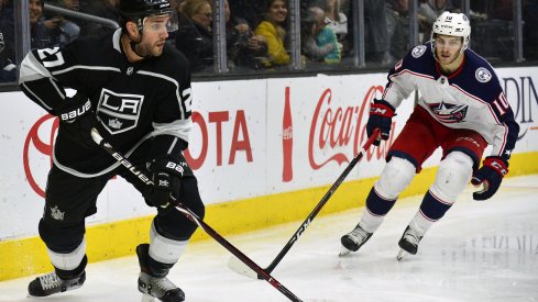 March 1, 2018; Los Angeles, CA, USA; Los Angeles Kings defenseman Alec Martinez (27) moves the puck against Columbus Blue Jackets center Alexander Wennberg (10) during the third at Staples Center. Mandatory Credit: Gary A. Vasquez-USA TODAY Sports