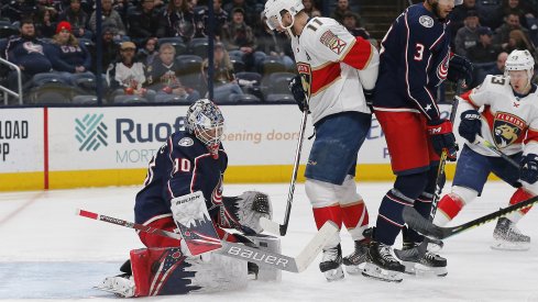 Columbus Blue Jackets goalie Elvis Merzlikins (90) makes a pad save as Florida Panthers left wing Jonathan Huberdeau (11) looks for a rebound during the first period at Nationwide Arena.