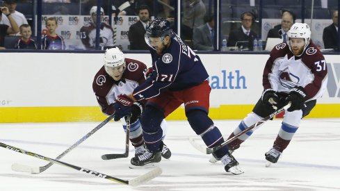 Oct 9, 2018; Columbus, OH, USA; Columbus Blue Jackets left wing Nick Foligno (71) stick handles past Colorado Avalanche left wing Matt Calvert (11) during the first period at Nationwide Arena.