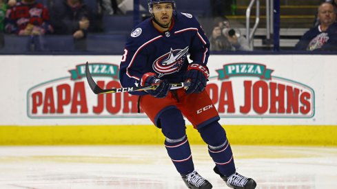 Columbus Blue Jackets defenseman Seth Jones (3) skates up ice with the puck ahead of Pittsburgh Penguins center Sidney Crosby (87) during the first period at PPG PAINTS Arena.