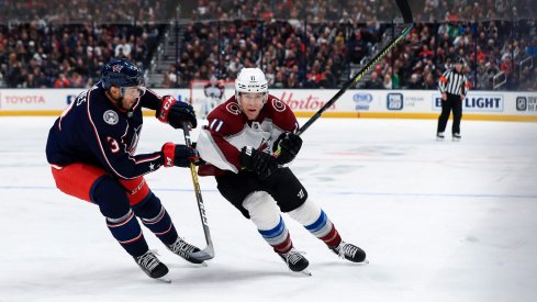 Feb 8, 2020; Columbus, Ohio, USA; Columbus Blue Jackets defenseman Seth Jones (3) battles against Colorado Avalanche left wing Matt Calvert (11) in the first period at Nationwide Arena.