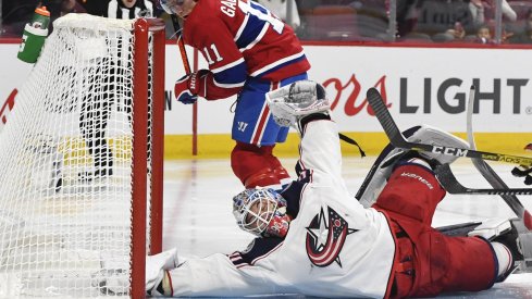 Feb 2, 2020; Montreal, Quebec, CAN; Columbus Blue Jackets goalie Elvis Merzlikins (90) makes a save against Montreal Canadiens forward Brendan Gallagher (11) during the second period at the Bell Centre.