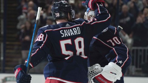 Columbus, Ohio, USA; Columbus Blue Jackets goaltender Joonas Korpisalo (70) is congratulated by center Stefan Matteau (23) after their win against the Vancouver Canucks at Nationwide Arena.