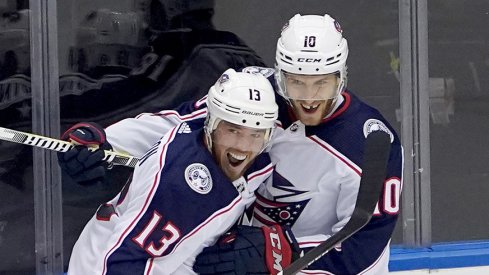 Cam Atkinson and Alexander Wennberg celebrate a goal against Toronto.