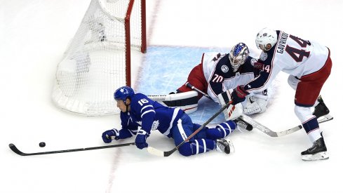 Vladislav Gavrikov keeps the puck out harm's way 