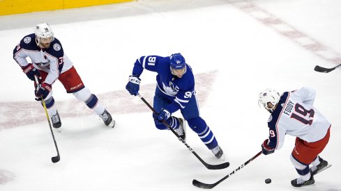 John Tavares #91 of the Toronto Maple Leafs is defended by during the first period in Game Two of the Eastern Conference Qualification Round prior to the 2020 NHL Stanley Cup Playoff at Scotiabank Arena on August 04, 2020 in Toronto, Ontario, Canada