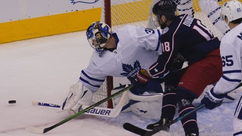 Toronto Maple Leafs goaltender Frederik Andersen (31) makes a save agsinst Columbus Blue Jackets forward Pierre-Luc Dubois (18) during the first period of Eastern Conference qualifications at Scotiabank Arena.