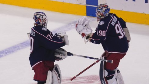 Columbus Blue Jackets goaltender Joonas Korpisalo (70) heads for the bench as he is replaced by goaltender Elvis Merzlikins (90) during the second period against the Toronto Maple Leafs in the Eastern Conference qualifications at Scotiabank Arena.