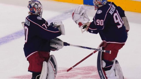 Aug 6, 2020; Toronto, Ontario, CAN; Columbus Blue Jackets goaltender Joonas Korpisalo (70) heads for the bench as he is replaced by goaltender Elvis Merzlikins (90) during the second period against the Toronto Maple Leafs in the Eastern Conference qualifications at Scotiabank Arena.