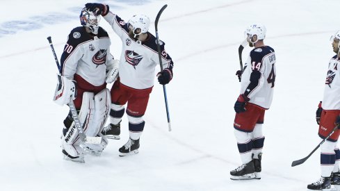 Joonas Korpisalo is congratulated by teammates after another strong outing for the Columbus Blue Jackets.