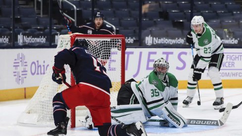 Feb 4, 2021; Columbus, Ohio, USA; Dallas Stars goaltender Anton Khudobin (35) reacts as Columbus Blue Jackets right wing Cam Atkinson (13) scores a goal in the third period at Nationwide Arena.