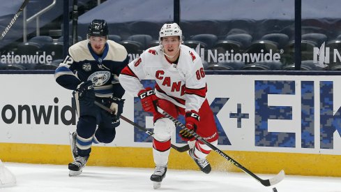 Carolina Hurricanes winger Teuvo Teravainen carries the puck as Columbus Blue Jackets center Alexandre Texier trails the play during the first period at Nationwide Arena.