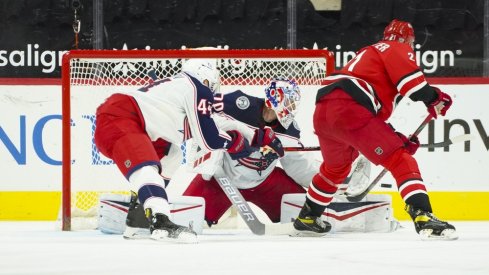 Columbus Blue Jackets goaltender Joonas Korpisalo (70) stops a shot by Carolina Hurricanes right wing Nino Niederreiter (21) during the first period at PNC Arena.