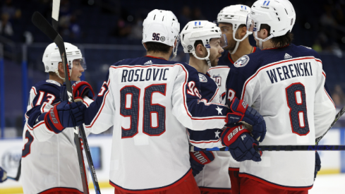 Columbus Blue Jackets right wing Oliver Bjorkstrand (28) is congratulated by teammates after scoring a goal against the Tampa Bay Lightning during the second period at Amalie Arena.