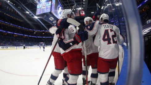 Columbus Blue Jackets defenseman David Savard (58) is congratulated after scoring a goal against the Tampa Bay Lightning during the second period at Amalie Arena.