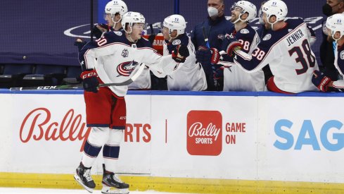 Apr 1, 2021; Tampa, Florida, USA; Columbus Blue Jackets left wing Eric Robinson (50) is congratulated as he scores a goal against the Tampa Bay Lightning during the third period at Amalie Arena.