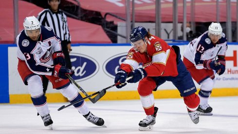 Columbus Blue Jackets defenseman Seth Jones (3) and Florida Panthers right wing Owen Tippett (74) battle for the puck during the second period at BB&T Center.