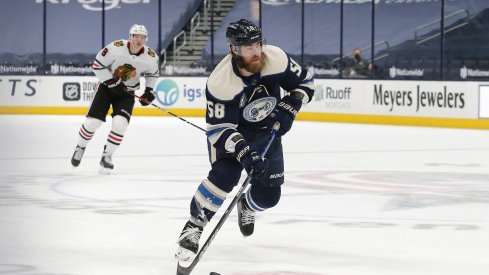 Columbus Blue Jackets defenseman David Savard (58) carries the puck against the Chicago Blackhawks during the first period at Nationwide Arena.