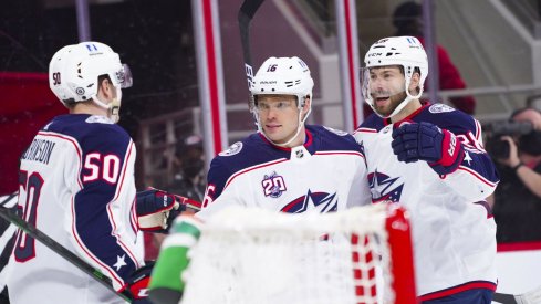 May 1, 2021; Raleigh, North Carolina, USA; Columbus Blue Jackets center Max Domi (16) is congratulated by center Boone Jenner (38) and left wing Eric Robinson (50) after scoring a first period goal against the Carolina Hurricanes at PNC Arena.