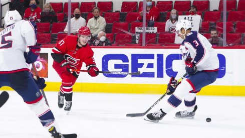 May 1, 2021; Raleigh, North Carolina, USA; Carolina Hurricanes right wing Andrei Svechnikov (37) takes a shot against Columbus Blue Jackets defenseman Seth Jones (3) at PNC Arena.