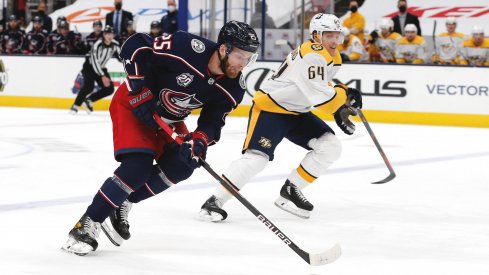 May 5, 2021; Columbus, Ohio, USA; Columbus Blue Jackets center Mikhail Grigorenko (25) controls the puck as enters the zone against the Nashville Predators during the first period at Nationwide Arena.