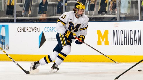 Kent Johnson skates with the puck.