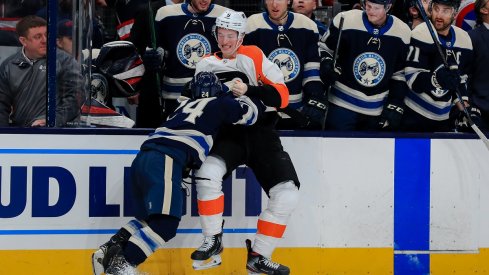 Nathan Gerbe fights Travis Sanheim at Nationwide Arena.