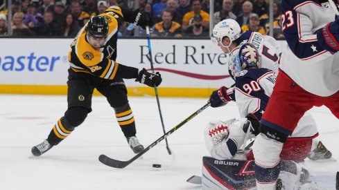 Boston Bruins' Craig Smith takes a shot on Columbus Blue Jackets' Elvis Merzlikins during the first period.