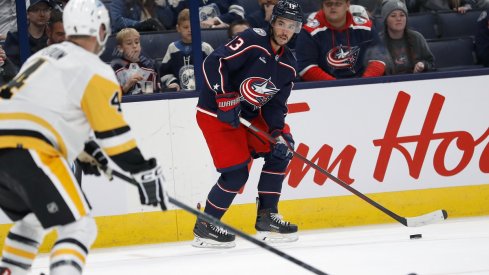 Johnny Gaudreau controls the puck against the Pittsburgh Penguins in his preseason debut