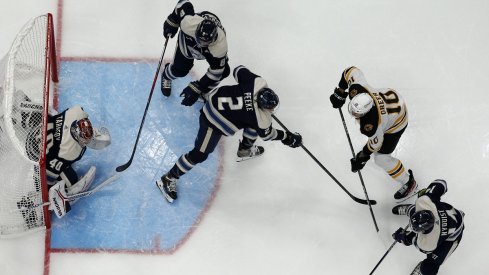 Columbus Blue Jackets goalie Daniil Tarasov makes a save against the Boston Bruins