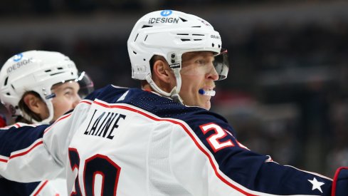 Columbus Blue Jackets' Patrik Laine celebrates his goal against Winnipeg Jets' David Rittich during the first period at Canada Life Centre.