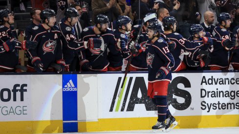 Columbus Blue Jackets' Johnny Gaudreau celebrates with teammates on the bench after scoring a goal against the Nashville Predators in the third period at Nationwide Arena.